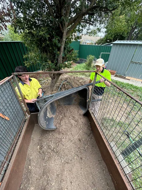 The crew removing excess soil on site